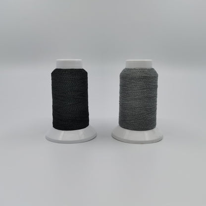 Reflective fabric sewing thread black and gray under natural light